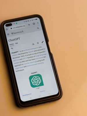 A smartphone displaying the Wikipedia page for ChatGPT, illustrating its technology interface.